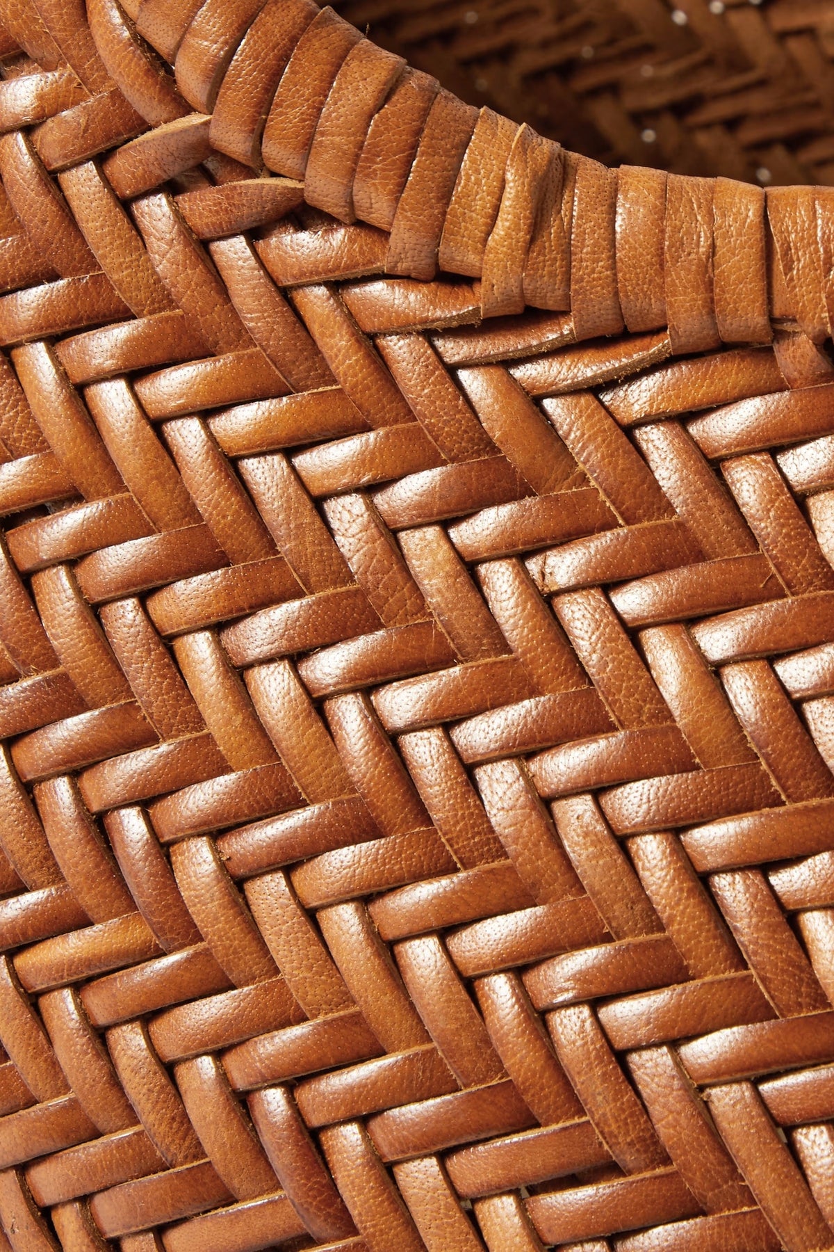 Close-up of the Nantucket Large Tote’s tan leather basket-weave craftsmanship.