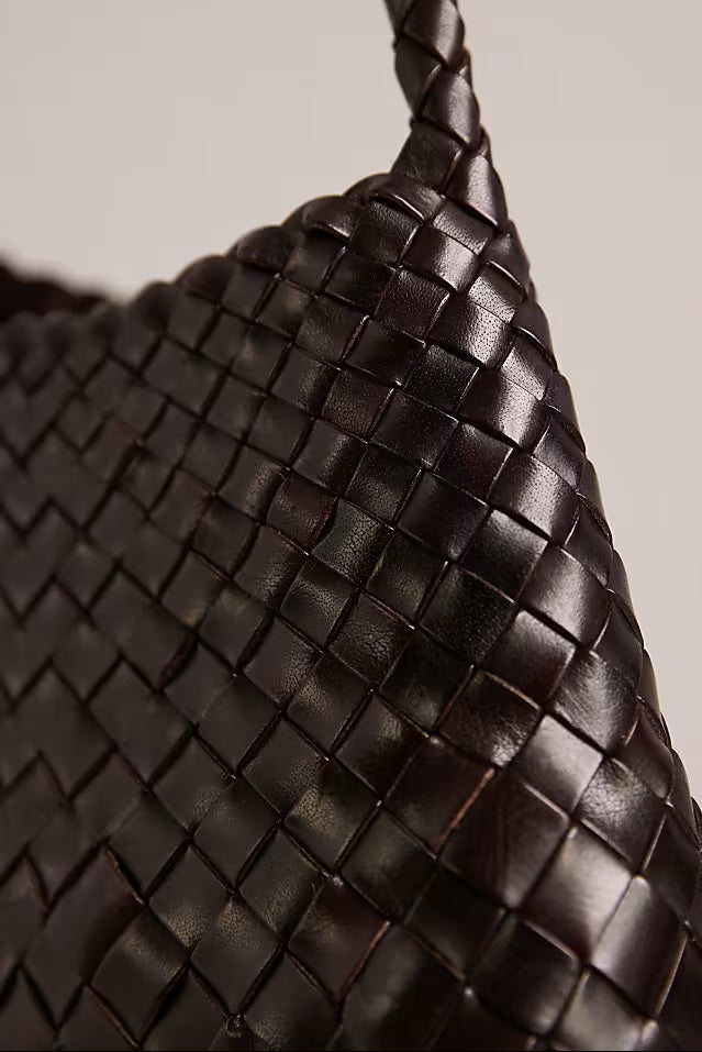 Close-up of the Rosalia Shoulder Bag’s dark-brown handwoven leather.