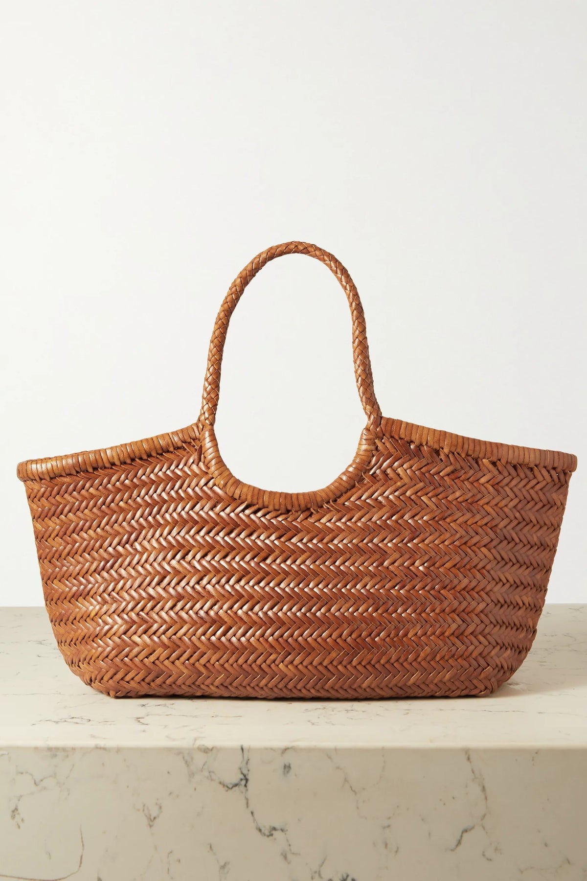 Front view of the Nantucket Large Tote in tan handwoven buffalo leather.