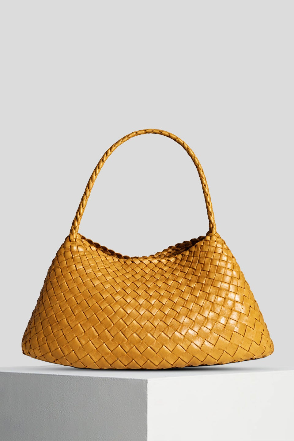 The Rosalia Medium woven leather shoulder bag with a braided strap.