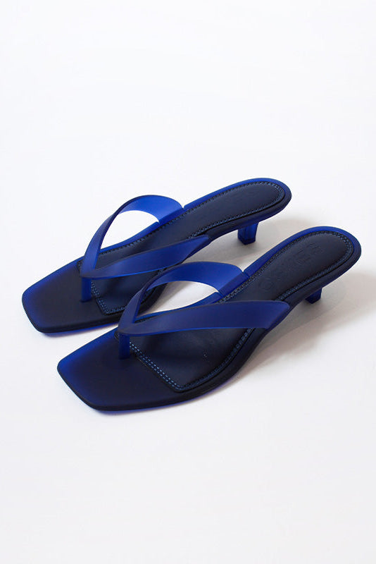 Senso Sonya blueberry flip flops pair with translucent thong straps angled view