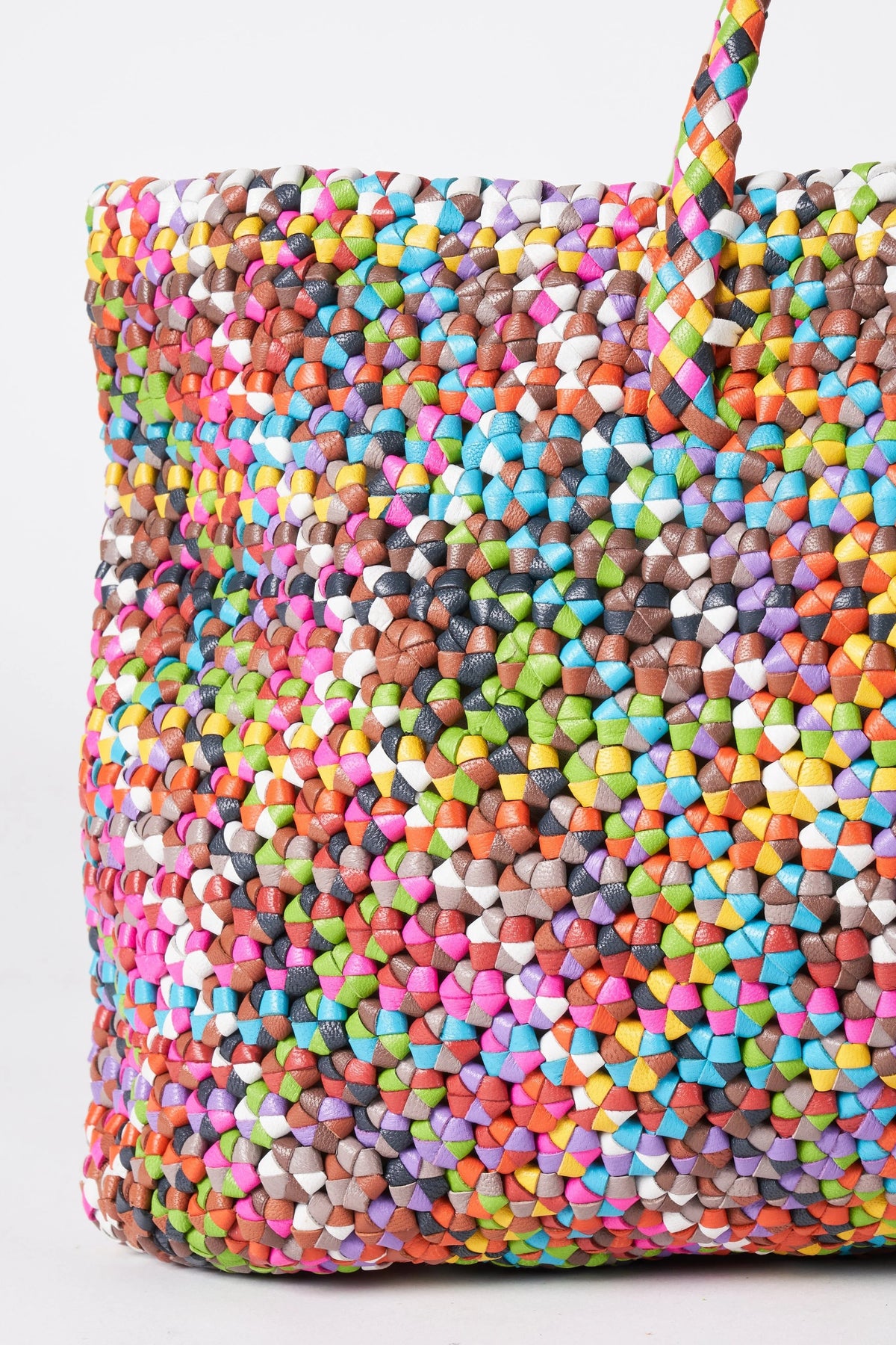 Close-up of the Octo Multi leather tote showing its intricate hand-knotted multicoloured construction.