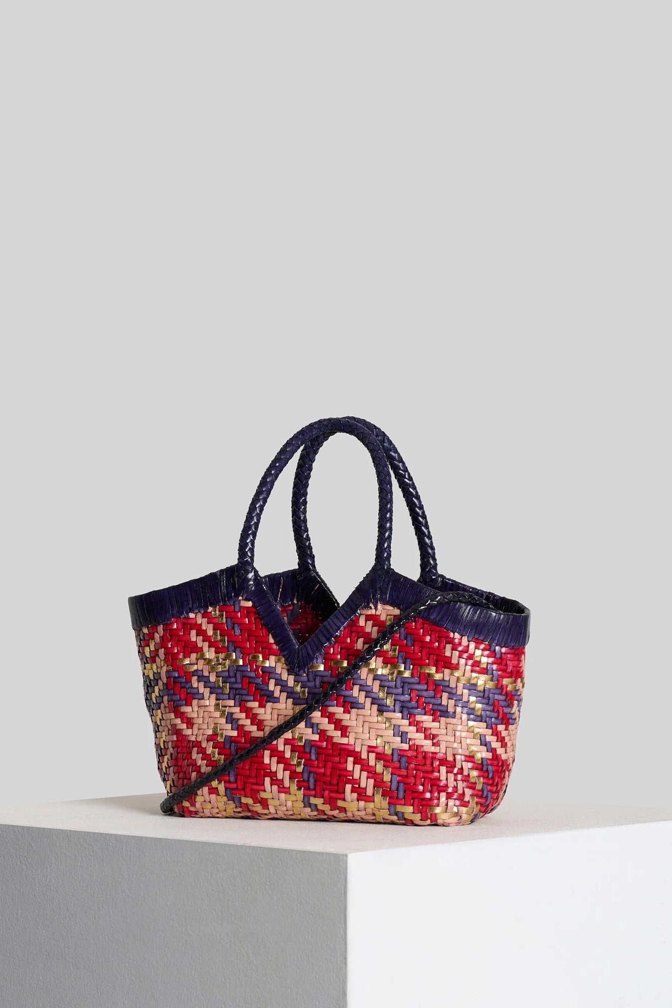 Vipera Monet Madras handwoven leather tote with multicolor woven pattern and detachable shoulder strap, angled front view.