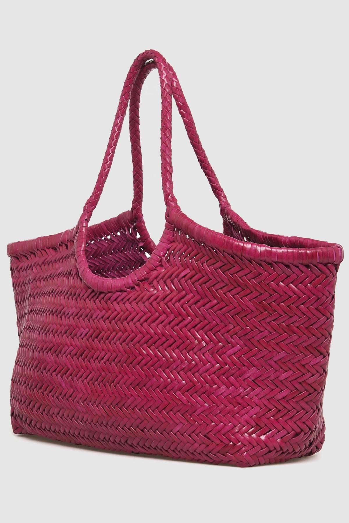 Angled view of the Dragon Diffusion Nantucket Large Tote in fuchsia.