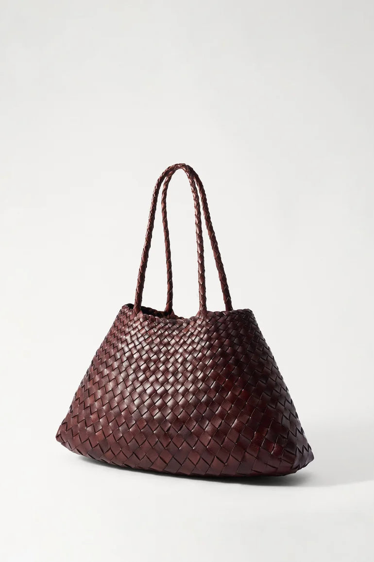 Angled view of the handwoven bruciato leather tote.