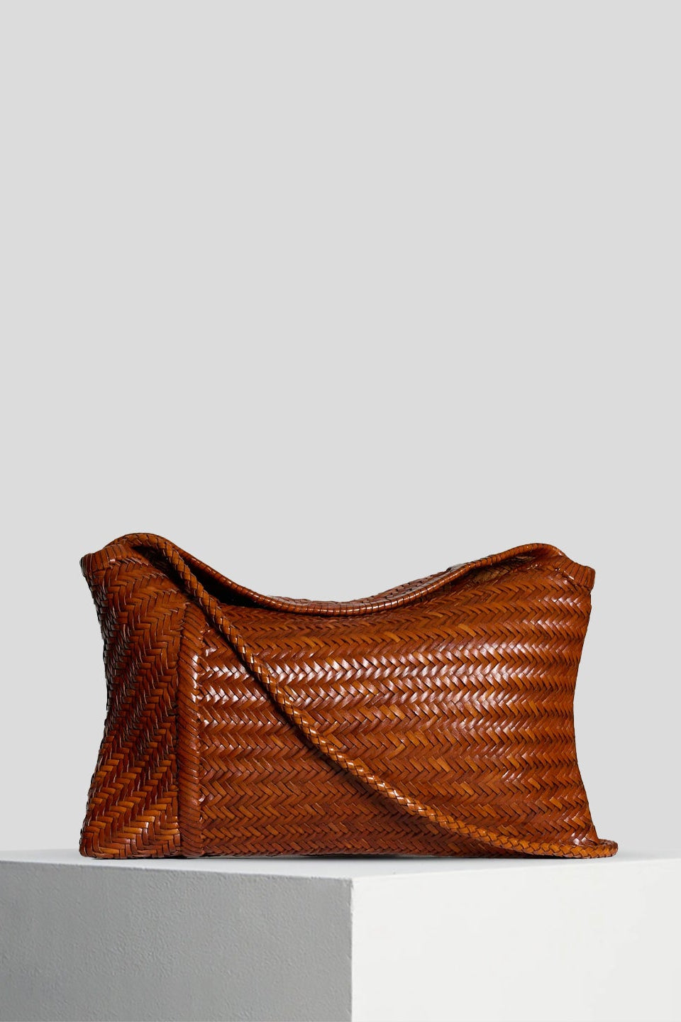 Front view of the Vipera Pillow Cognac handwoven leather shoulder bag in rich cognac leather.