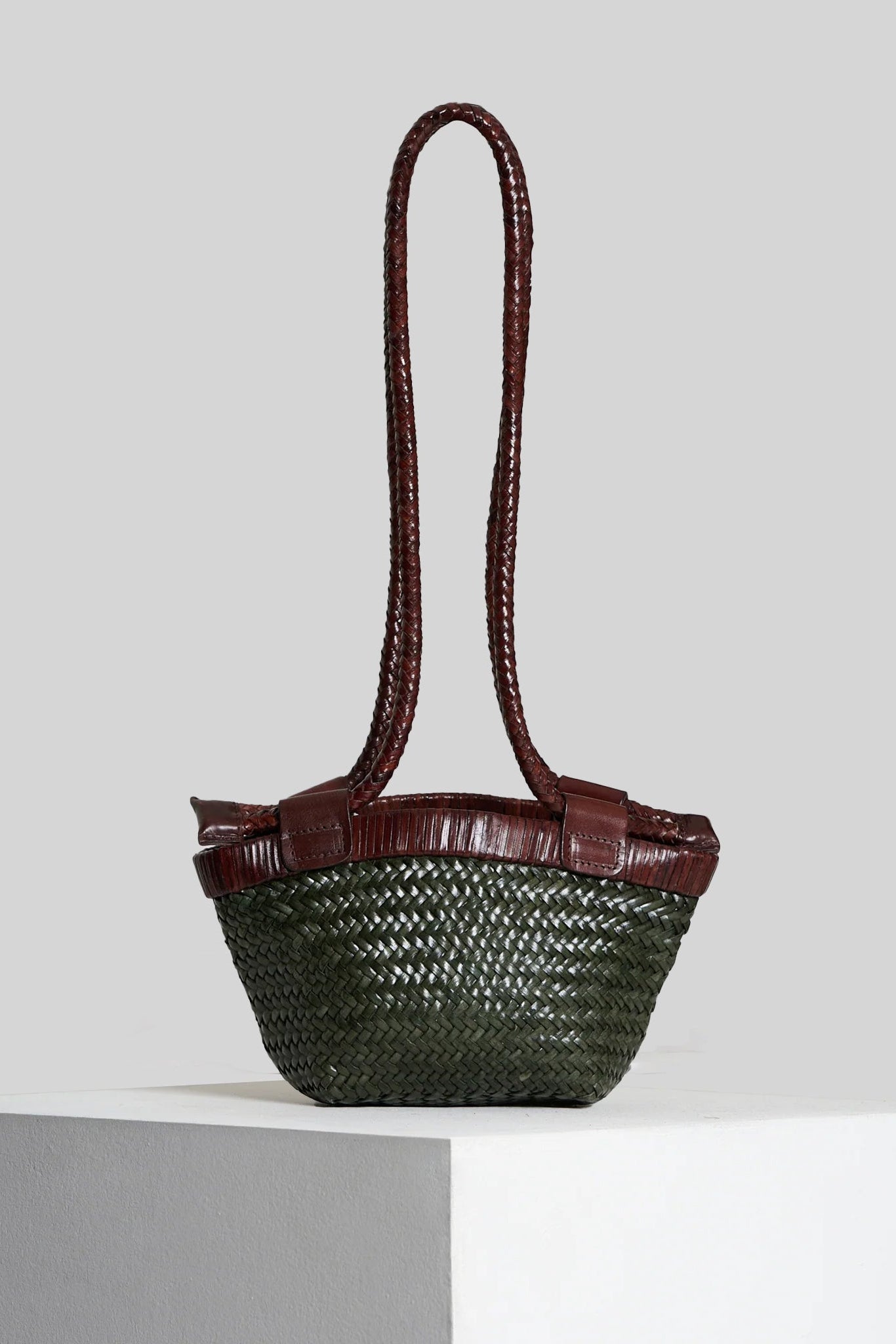 Vipera Gauguin Moss-Chocolate handwoven leather bag in matcha green and chocolate leather with adjustable braided handles extended.