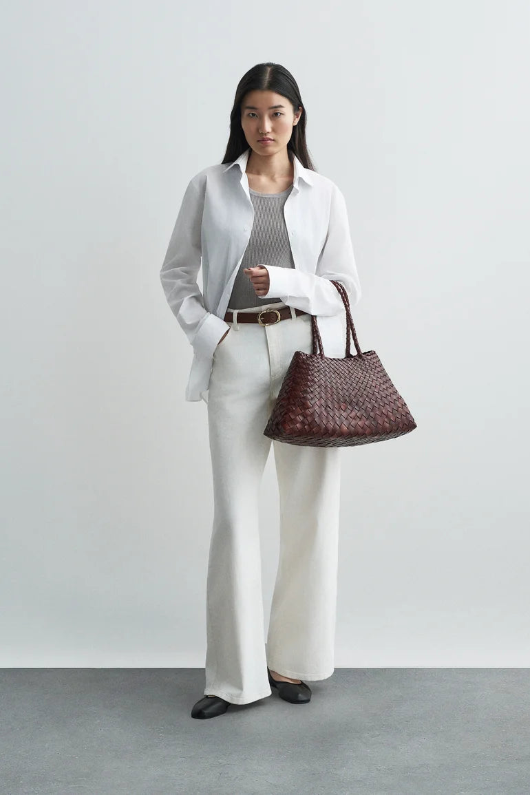 Model carrying the bruciato Santa Croce Large Tote with a neutral outfit.
