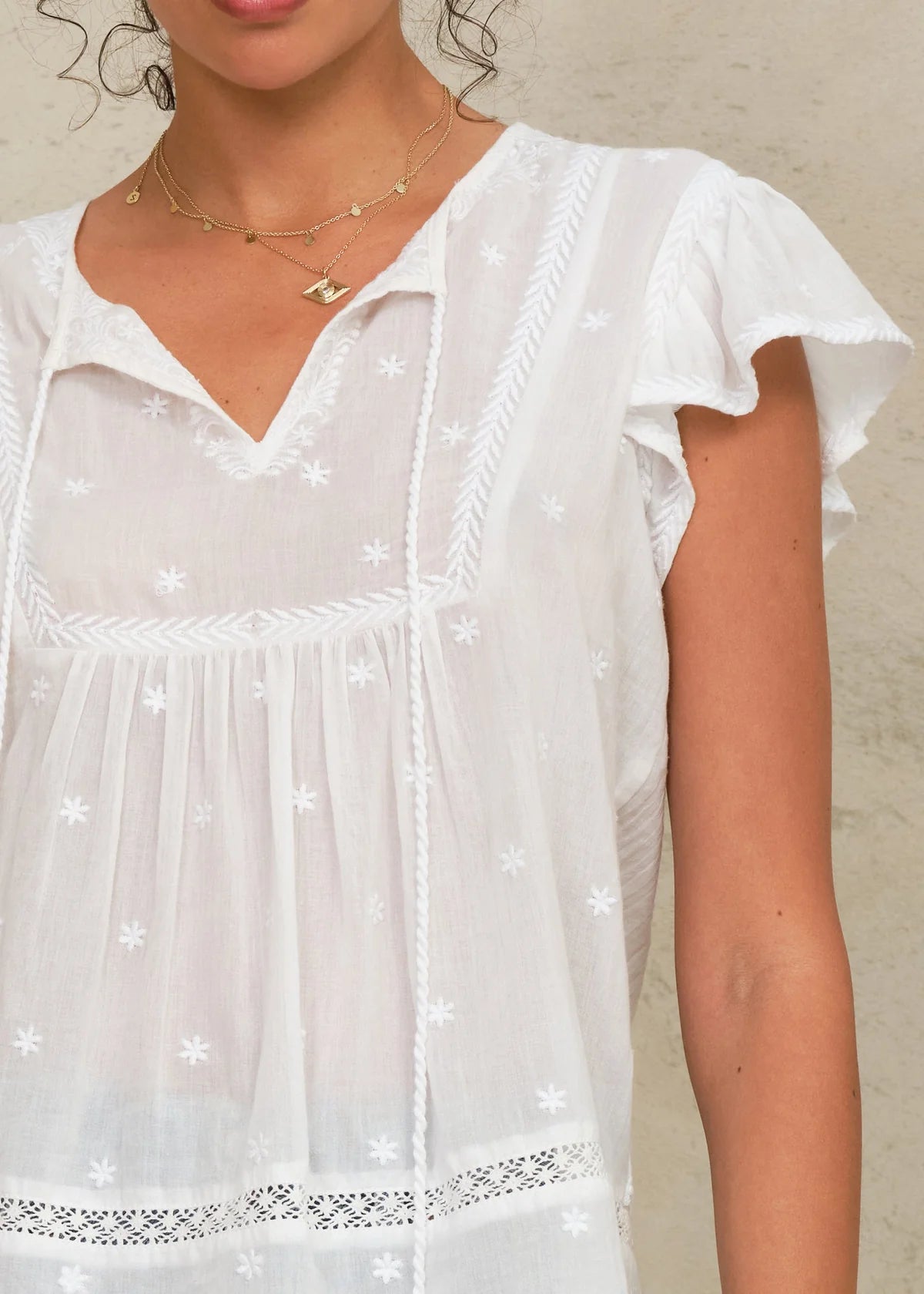 Close-up of M.A.B.E Navi top embroidery detail