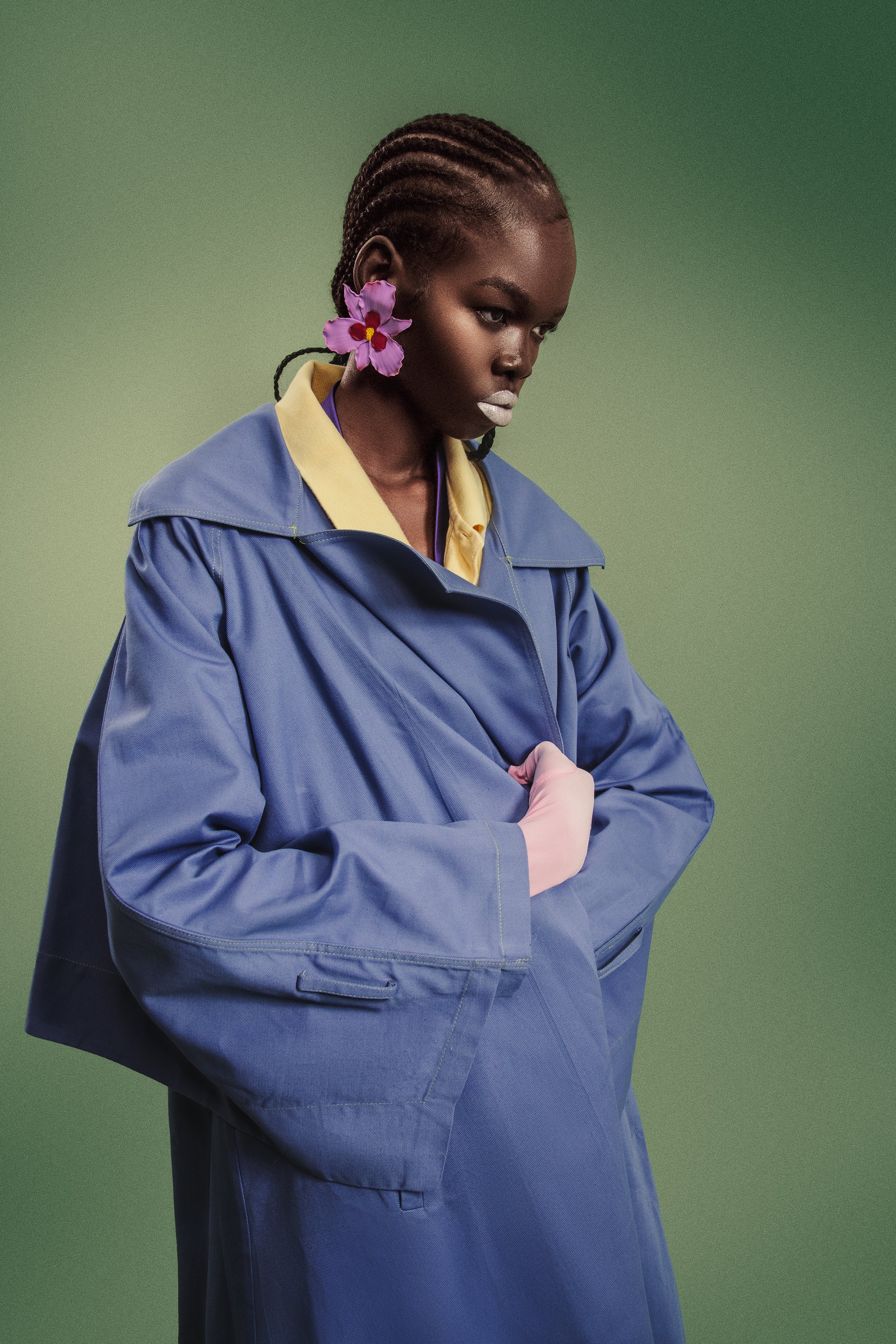 Model wearing oversized Mulberry Bloom Earrings styled with a contemporary tailored look.