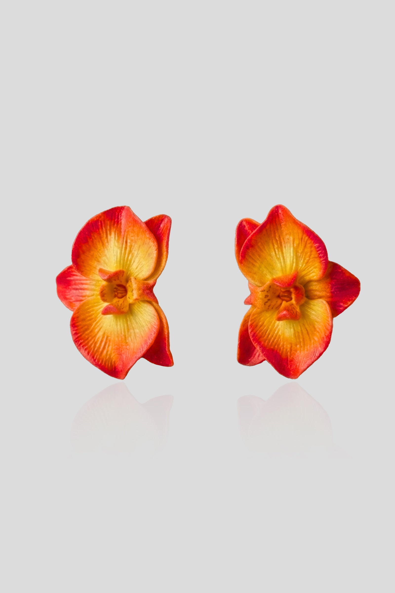 Handcrafted Sunset Orchid Earrings in polymer clay with radiant yellow-to-red gradient petals, lightweight floral statement earrings inspired by tropical orchids.