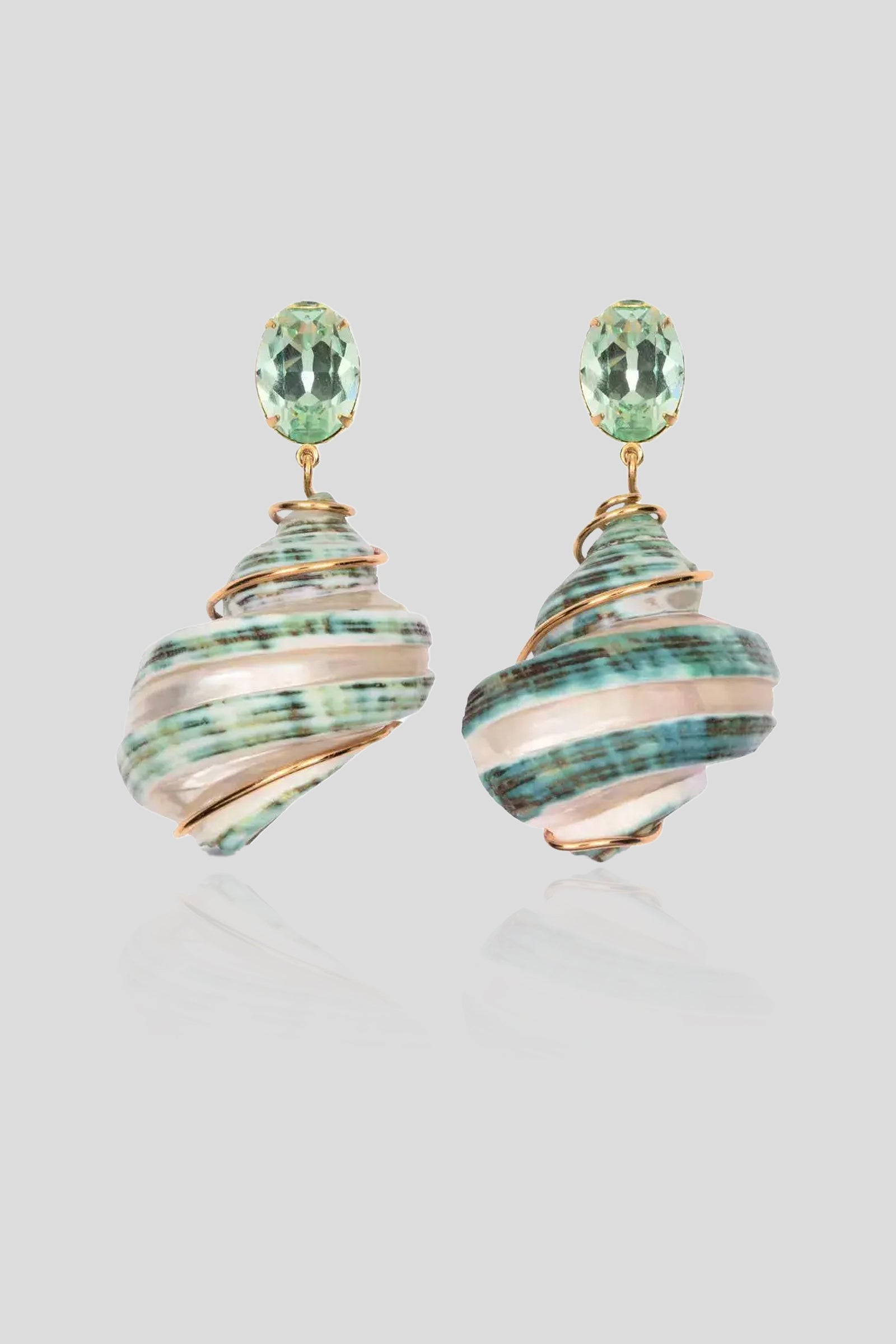 Jennifer Behr Wave Earrings featuring natural green spiral shell pendants with sparkling green crystal studs.