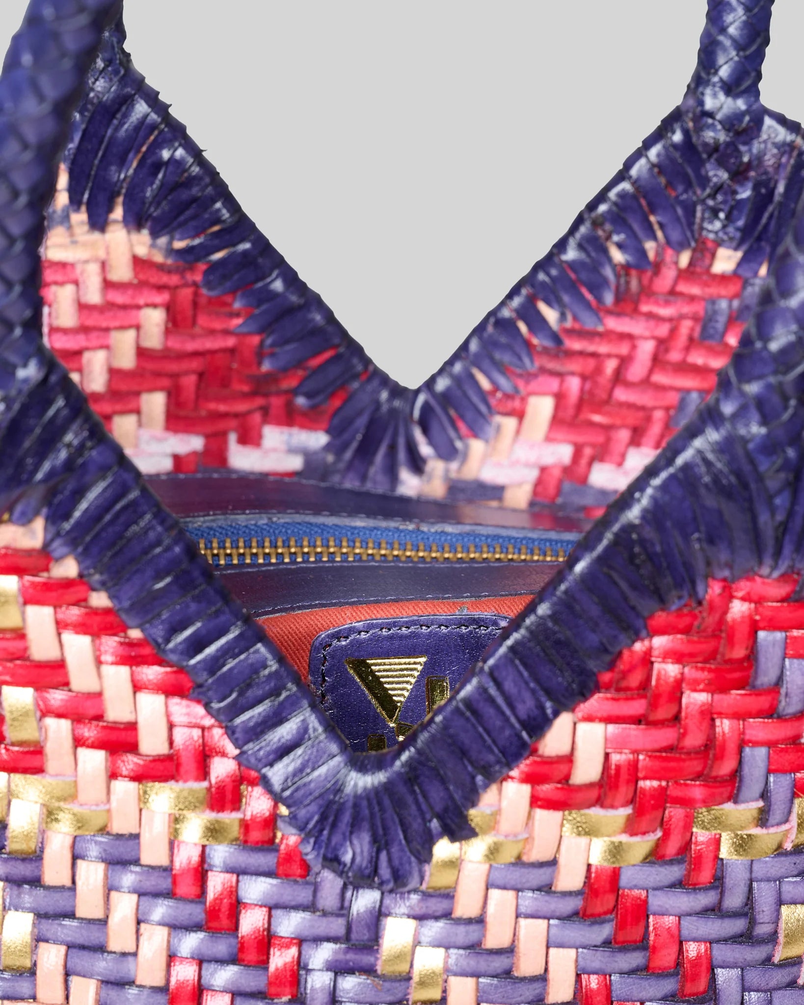 Detailed view of the Vipera Monet Madras bag showcasing the intricate handwoven leather pattern.
