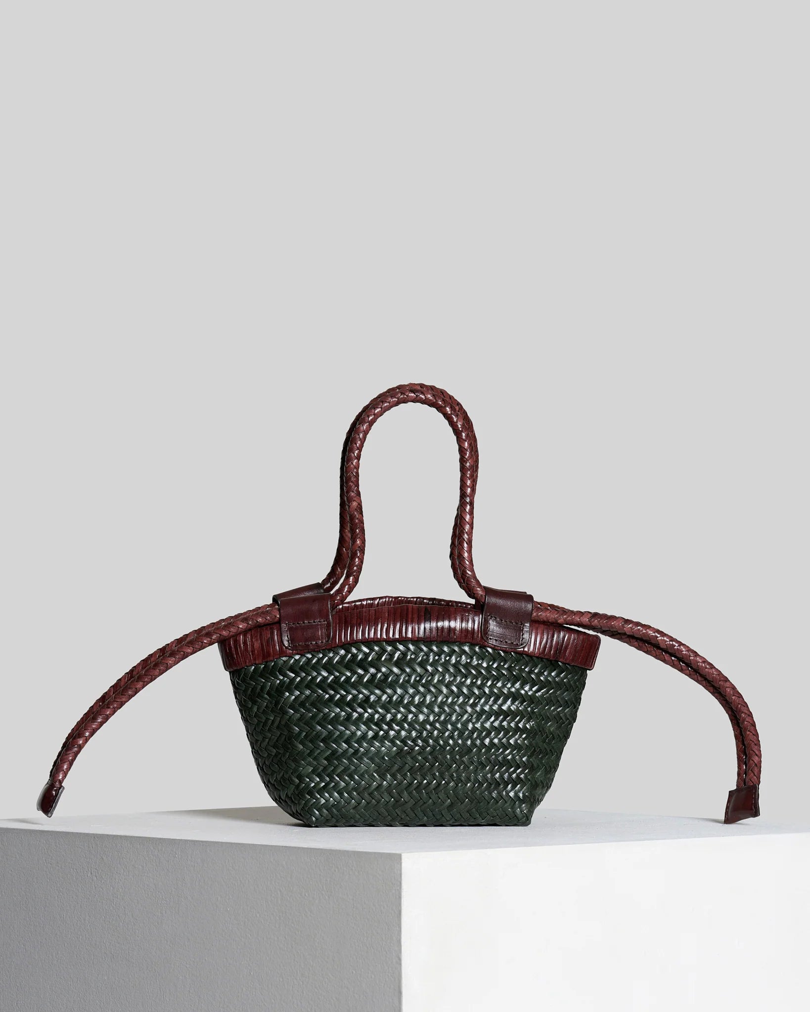 Front view of the Vipera Gauguin Moss-Chocolate woven leather bag with long adjustable braided shoulder handles.