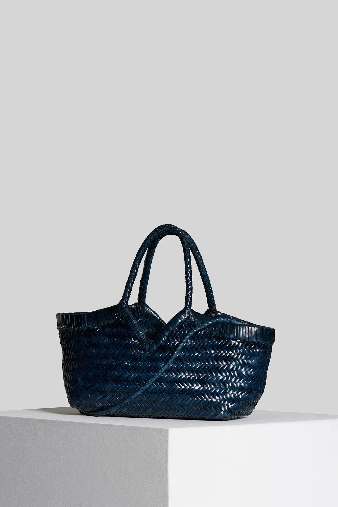 Vipera The Label Monet Dark Blue handwoven leather tote bag angled front view with removable shoulder strap
